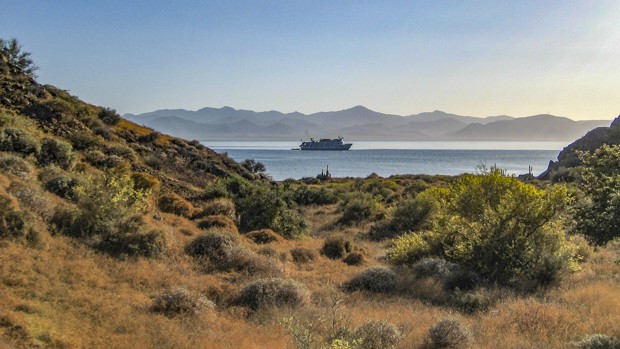 Small ship in calm bay in Baja California. 