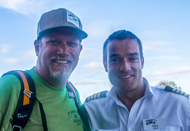 AdventureSmith founder Todd Smith interviewing Captain Gary Walsh on a Great Barrier Reef Australia small ship cruise. 