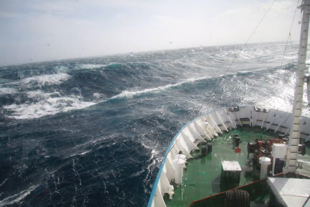 Small ship in rough waters crossing the Drake Passage to Antarctica. 