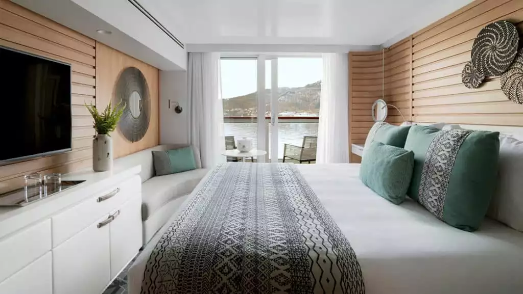 Prestige Stateroom - Decks 4, 5 & 6 with king bed aboard Le Champlain. Photo by: Francois Lefebvre/Ponant
