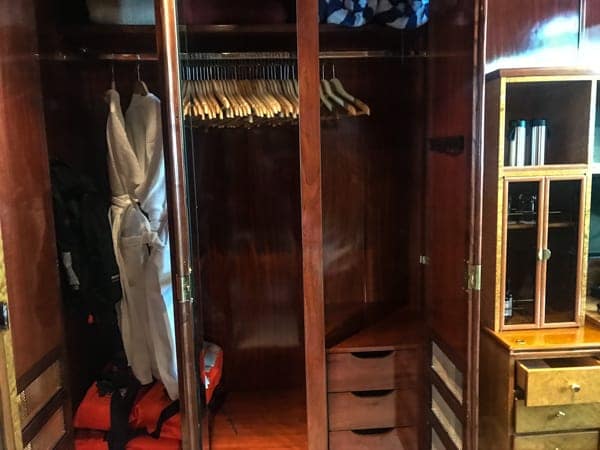 cabin storage closet aboard hebridean sky polar expedition ship, wooden closet with hangers a safe and life vets.   