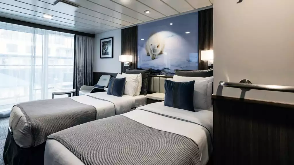 Category C Balcony Stateroom with twin beds aboard Sylvia Earle. Photo by: Richard l'Anson