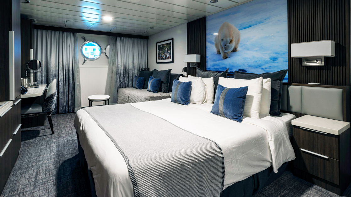 While cruising the polar waters stay warm and comfortable in the Triple Stateroom aboard the Sylvia Earle with large plush beds