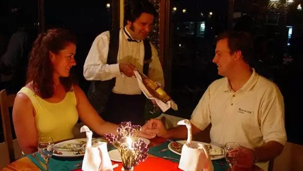 A happy couple having dinner at a local Costa Rican restaurant.