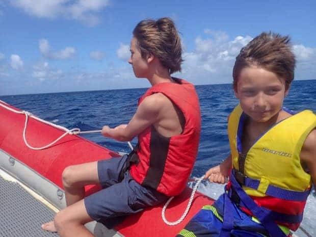 Two kids on an inflatable boat in Australia