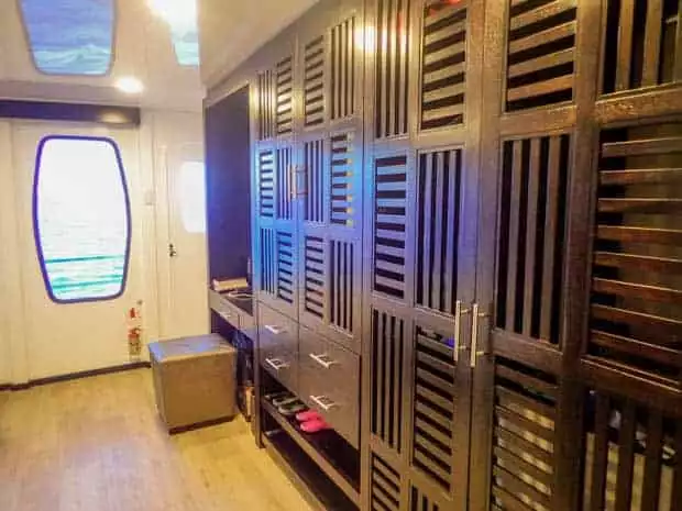 Storage area on the small ship catamaran Alya with a door access out to the deck.