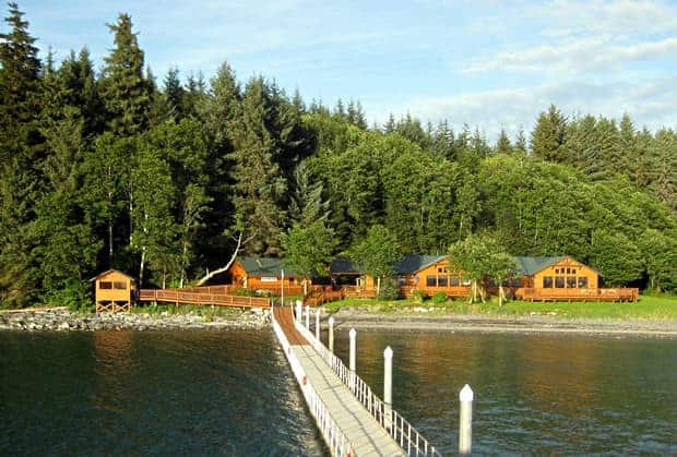 Orca Point Lodge sitting on the coastal shore in the Alaskan Rain Forest.