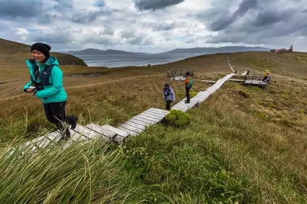 People hiking up a boardwalk in Cape Horn. 