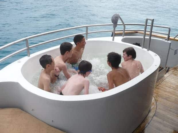 Group in a hot tub aboard their small ship cruise in the Galapagos. 