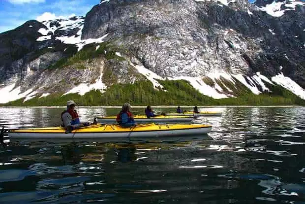Guests from a small ship cruise on kayaking excursion from the Sea Wolf in Alaska. 
