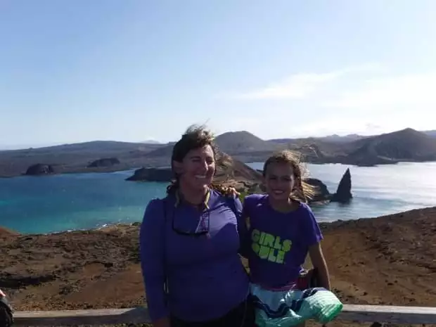 Mother and daughter smiling on a hiking tour in the Galapagos from their small ship cruise. 