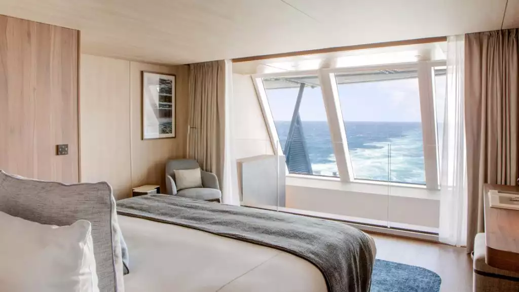 Duplex Suite bedroom with king bed aboard Le Commandant Charcot. Photo by: Gilles Trillard/Ponant