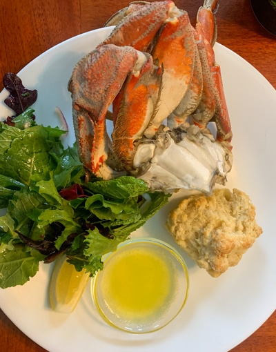 A plate of Alaskan crab dinner, fresh local cuisine, served aboard Alaska  small ship catalyst. 