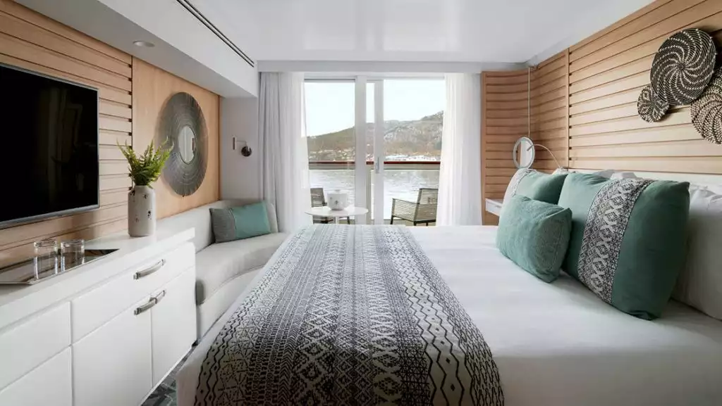 Prestige Stateroom - Decks 4, 5 & 6 with king bed aboard Le Dumont D'Urville. Photo by: Francois Lefebvre/Ponant