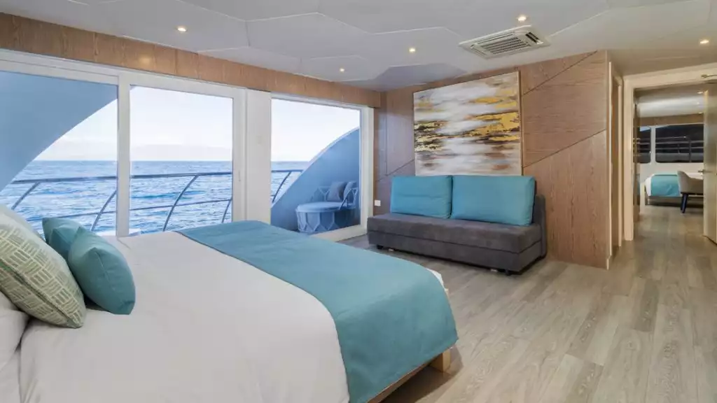 Golden Suite with king-sized bed and interconnecting aboard the Elite