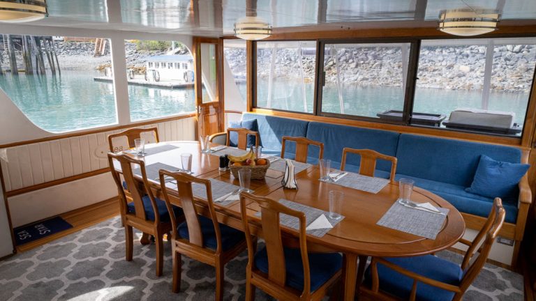 A comfortable and intimate dining room wrapped in windows with views on this cruise aboard the Sea Star one of many beauties