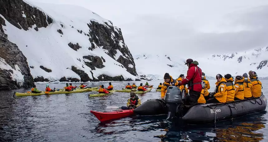 Quark expeditions, a top Antarctica cruise line begins their daily activity excursions, with guests enjoying a zodiac ride and kayaking.