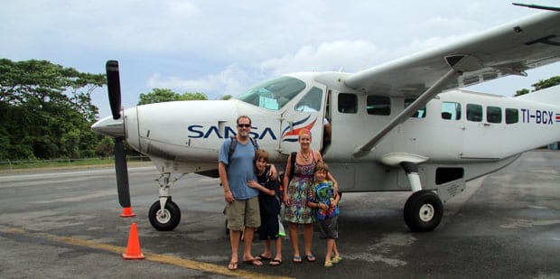 Family getting ready to embark on a small plane in Costa Rica.