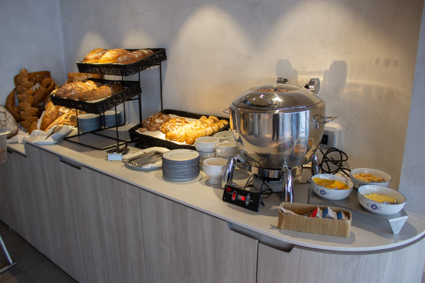 Buffet Style breakfast in Sila Restaurant aboard Le Commandant Charcot with breads, pastries and fondue.