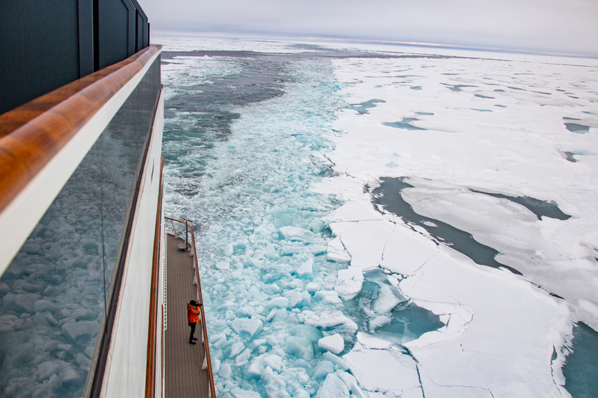 Le Commandant Charcot ship leaves a broken path free of ice behind it as it crushes ice sheets cruising to the North Pole.