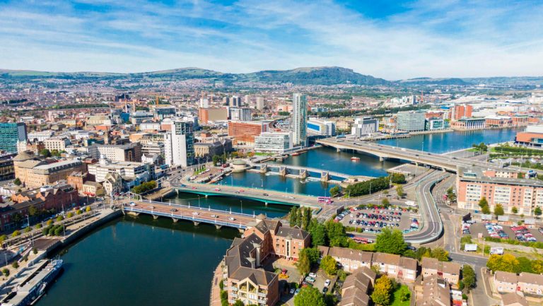 Aerial view on river and buildings in City center of Belfast Northern Ireland. Drone photo, high angle view of town.