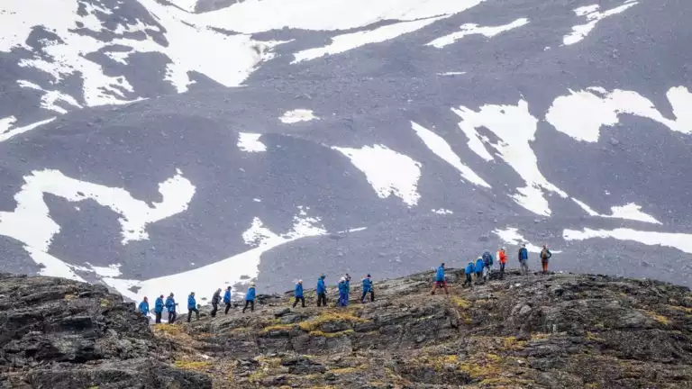 Guests from the National Geographic Endurance hiking in the mouatins of Signehamna, Svalbard, Norway.