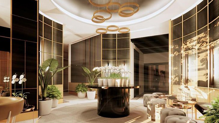 Rendering of Hotel Reykjavik Saga lobby with art deco design, white lilies in a vase, glass, gold, beige floor & bright lighting.