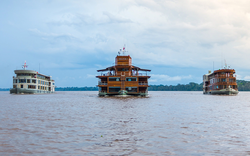 The Peruvian Amazon Delfin fleet all cruise the river side by side. From L to R: Delfin III, Delfin I, Delfin II