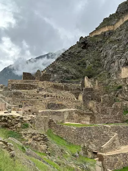 Ollantaytambo village in Sacred Valley of Peru. With it's ancient Inca fortress with large stone terraces on a hillside.