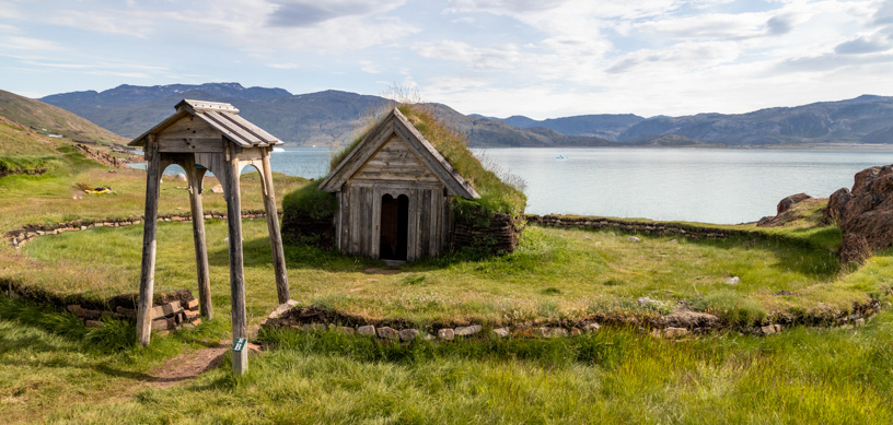 Seen on a Greenland cruise, a 14th century wood chapel with a roof covered in grass set on a lush green hill by the sea, named for Erik the Red’s wife.