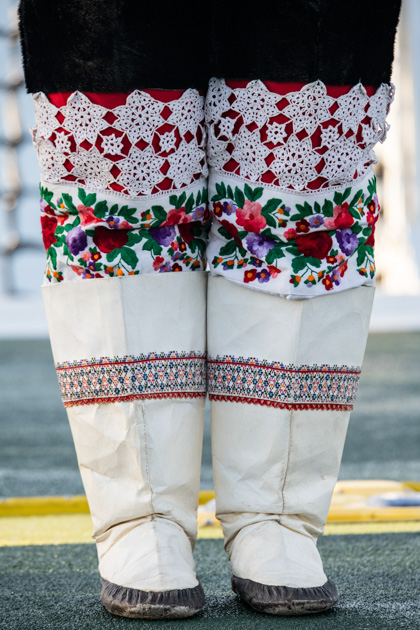 Bottom half of traditional Inuit outfit.  inner footwear, and outer boots, made of animal hide with intricate needlework