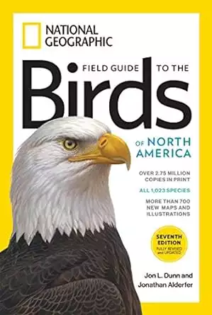 Book cover of the National Geographic Field Guide to the Birds of North America with a yellow border a large bald eagle head and the book title, authors and awards listed.  