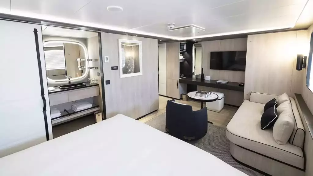 Mistral Junior Suite with king bed aboard Le Ponant/ Photo by: Ponant
