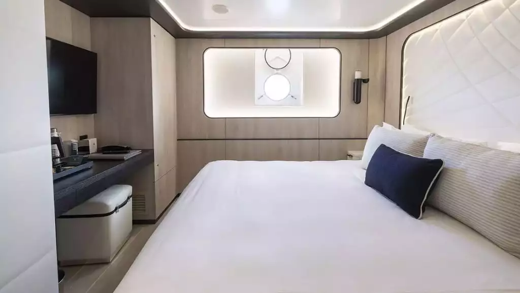Mistral Stateroom with king bed aboard Le Ponant. Photo by: Ponant