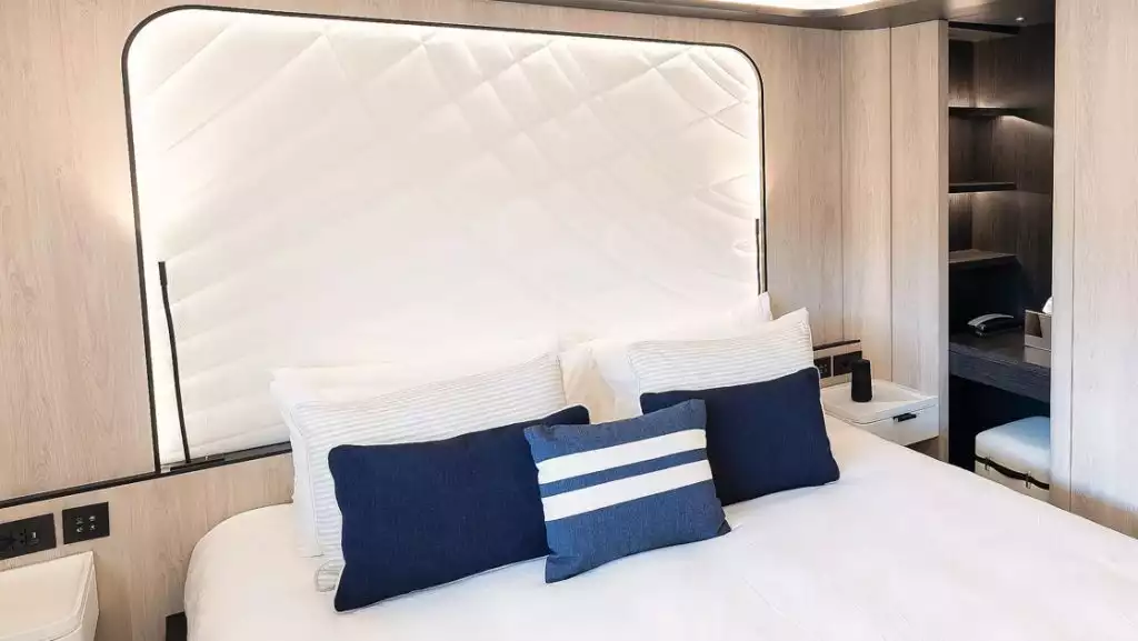 Owner's Suite with king bed aboard Le Ponant. Photo by: Ponant