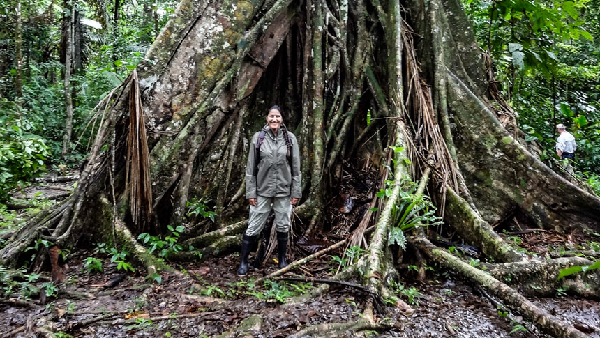 A women standing in front of jungle