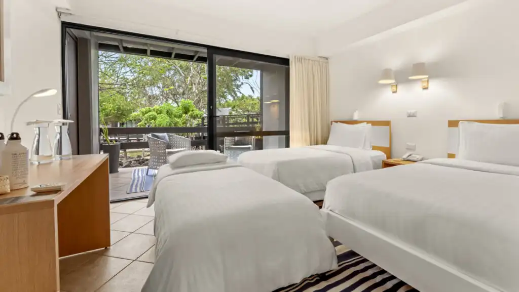 Premium Room with full-size beds & extra twin bed at Finch Bay Eco Hotel