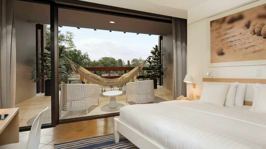 Premium Room at Finch Bay Hotel in Ecuador with king bed in white linens, private deck with hammock, wood desk & glass wall.
