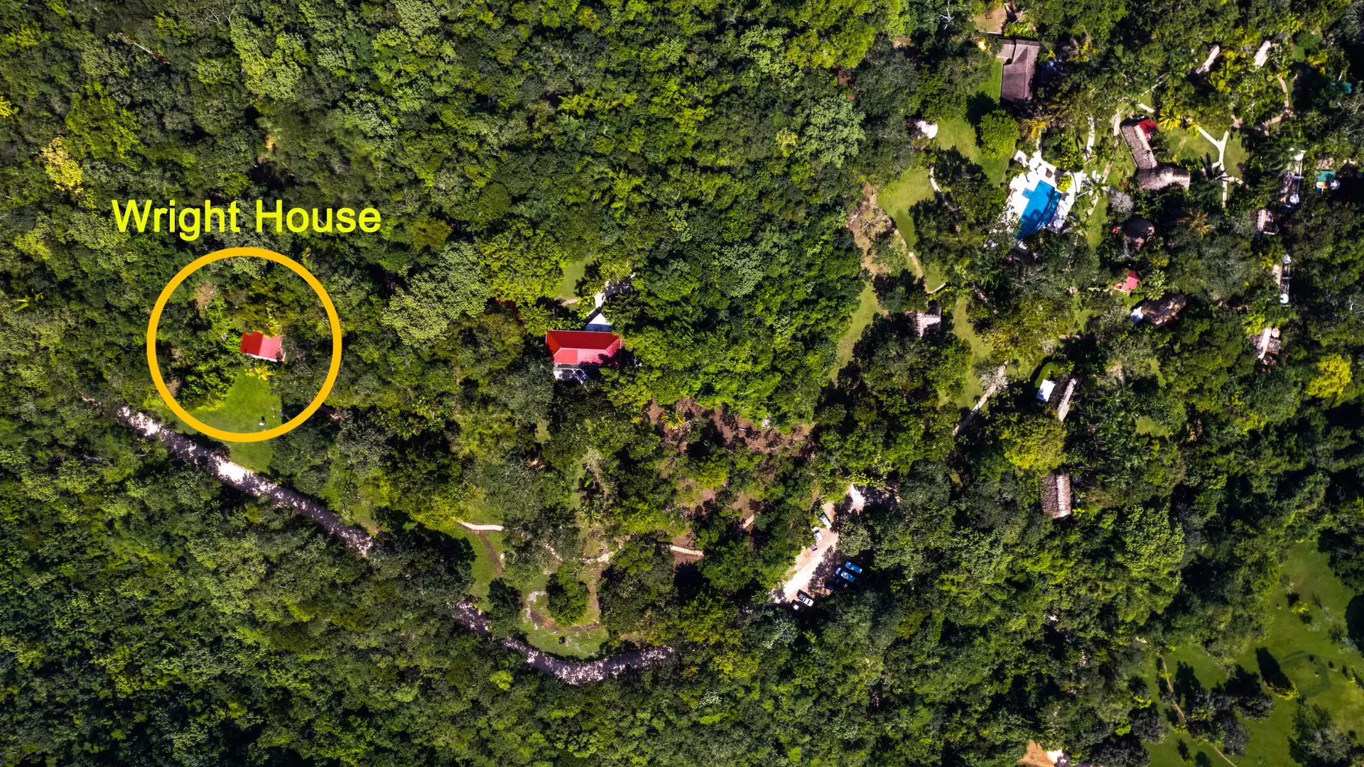 Aerial view of The Lodge at Chaa Creek grounds with the Wright House circled, located down a path from the main buildings.