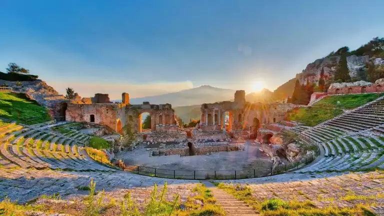 Accent Greek amphitheater built into the hill overlooking a breath taking sunset on a clear day.