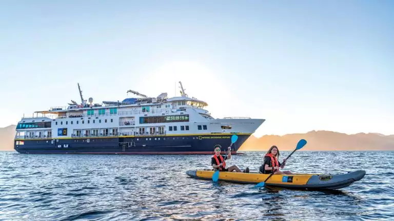 Kayaking w/NatGeo Venture in Background in San Evaristo Baja California Sur, Mexico