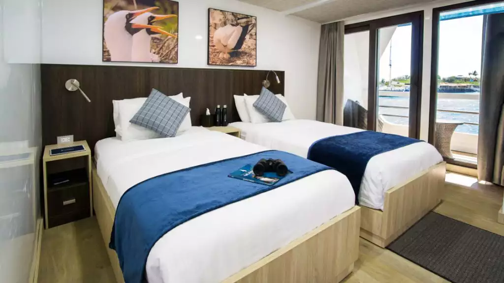Upper Deck Junior Suite with twin beds aboard Natural Paradise
