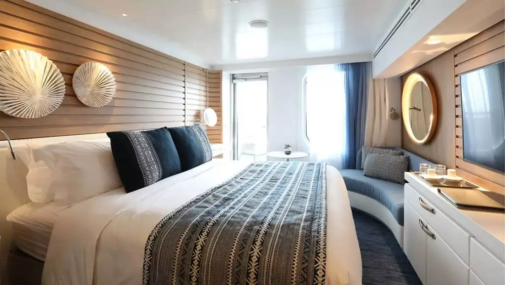 Deluxe Stateroom with king bed aboard Le Laperouse. Photo by: Ponant