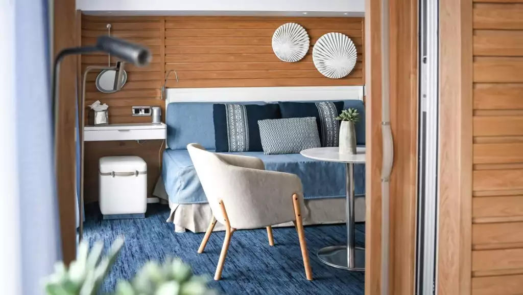 Prestige Suite second room (lounge) aboard Le Laperouse. Photo by: Ponant