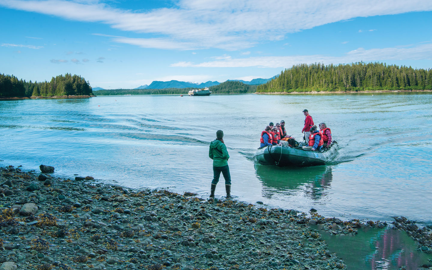 a group of adventure travelers coming ashore during a San Juan Islands small ship cruise in the pacific northwest