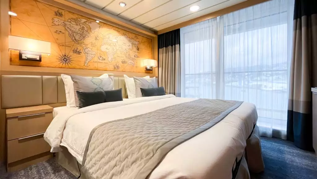 Deluxe Veranda Forward Stateroom with double bed aboard Ocean Explorer. Photo by: Quark Expeditions