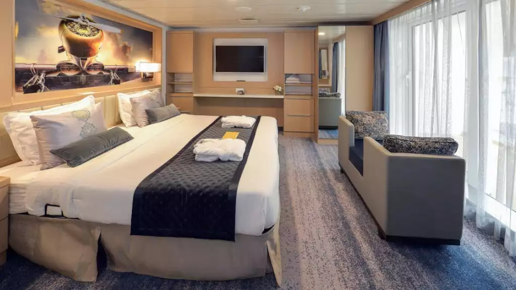 Owner's Suite bedroom with double bed aboard Ocean Explorer. Photo by: Quark Expeditions