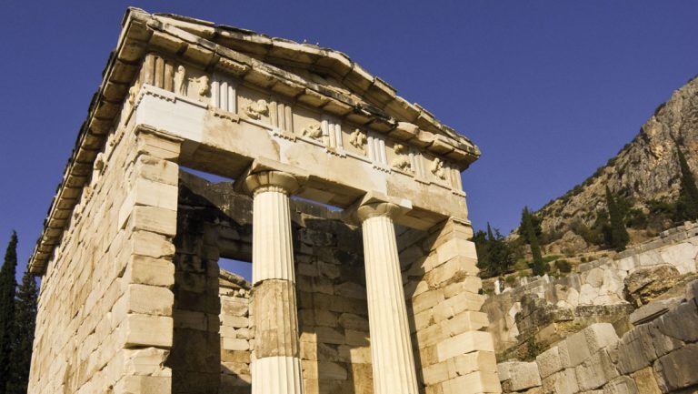 Greek ruins of tan stone with columns & 4 walls, seen on the Greece, Croatia & Albania cruise on Nat Geo Orion.