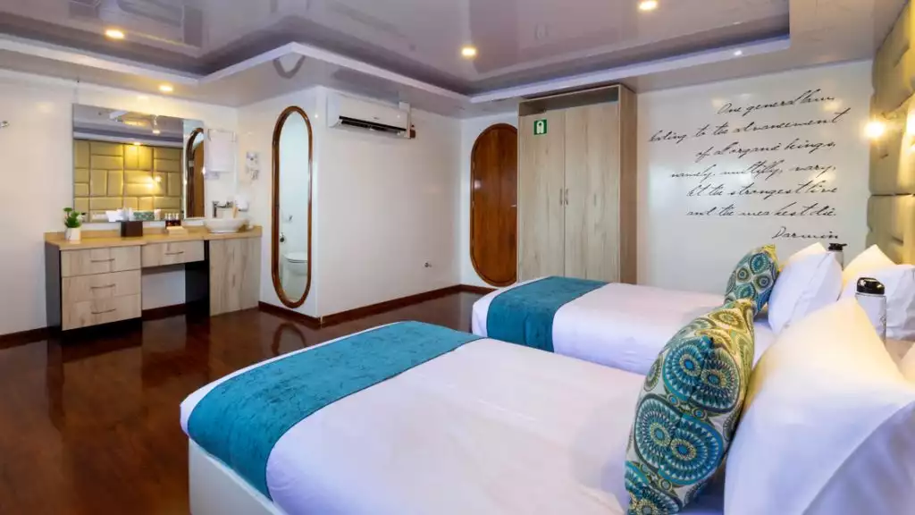 Golden Stateroom with twin beds aboard Petrel