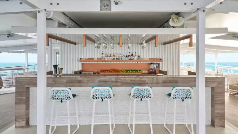 Outdoor bar with 4 barstools on a small ship cruise